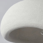 Close-up of a textured white surface with a gray background