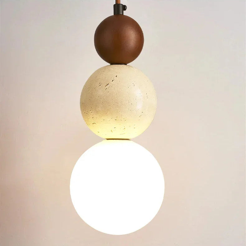 Modern pendant light with spherical design on a neutral background, featuring the text 'Design from nature'.