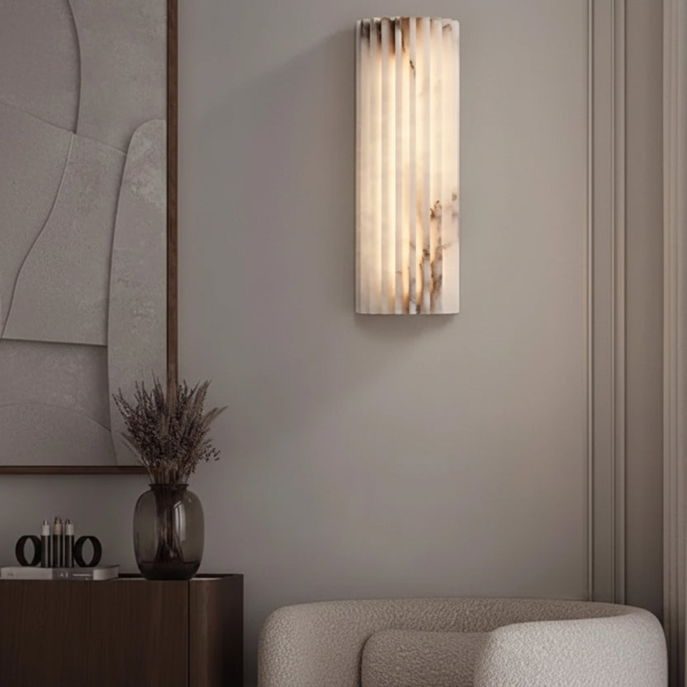 Modern wall sconce in a stylish interior setting with a mirror and decorative items.