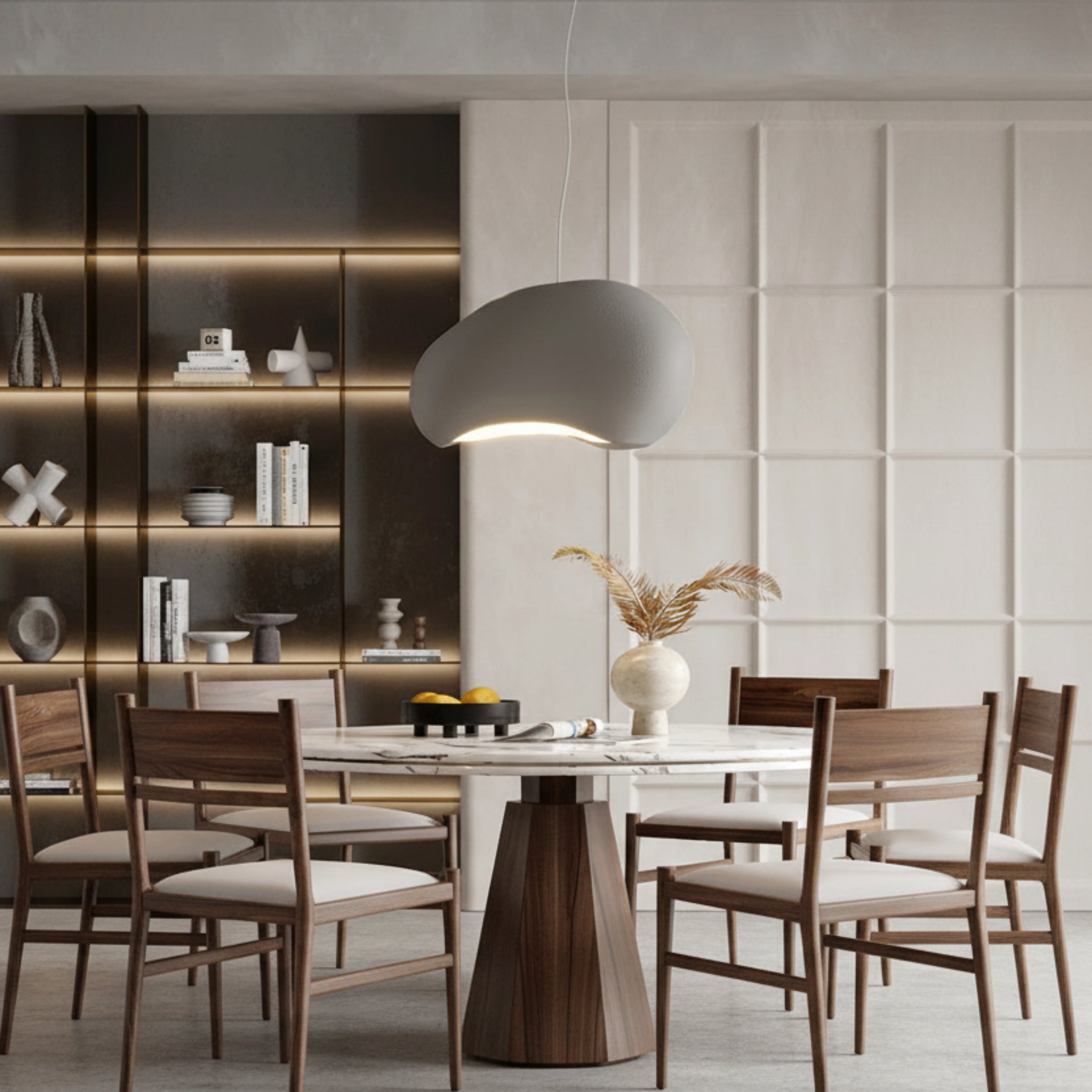 Modern dining area with a gray pendant light, marble table, and wooden chairs.