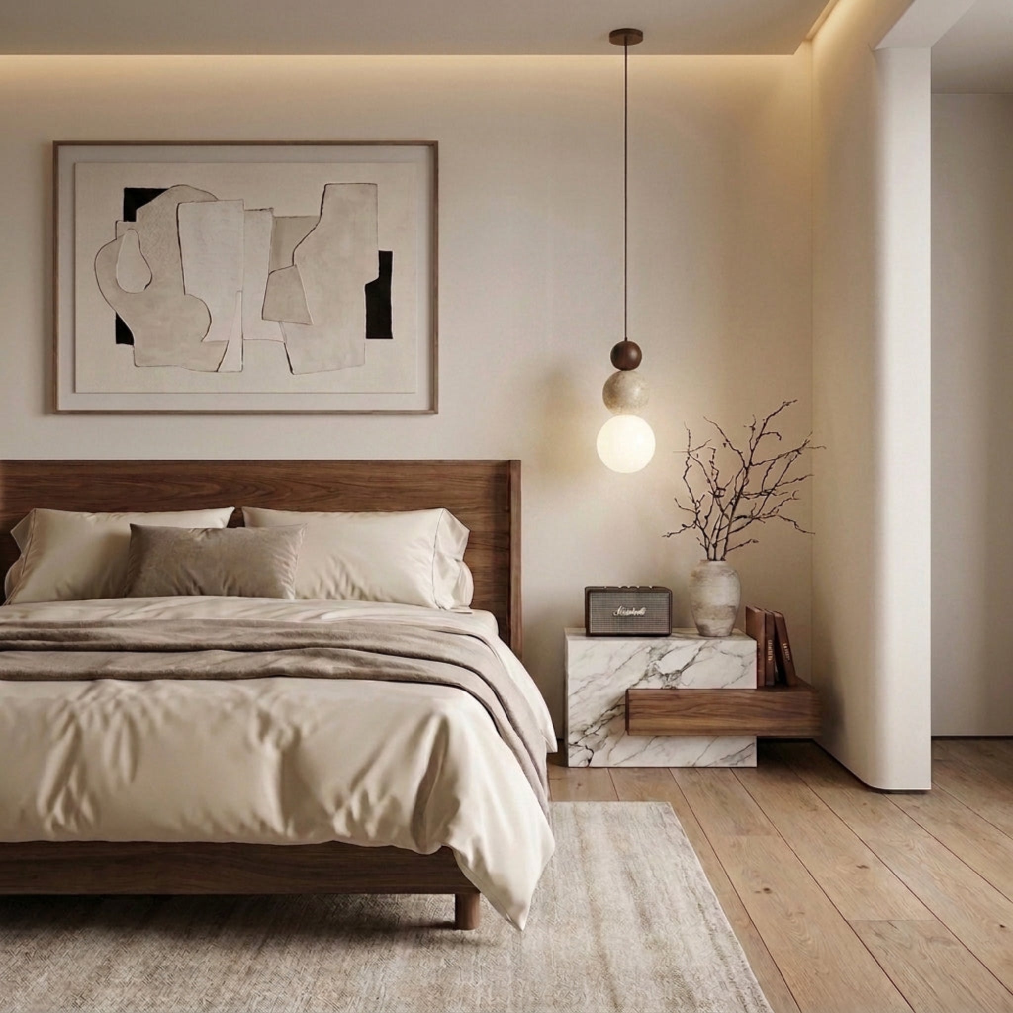 A modern bedroom interior featuring a bed dressed in beige bedding, a marble nightstand with a hanging light fixture, framed abstract wall art, and light wood flooring.