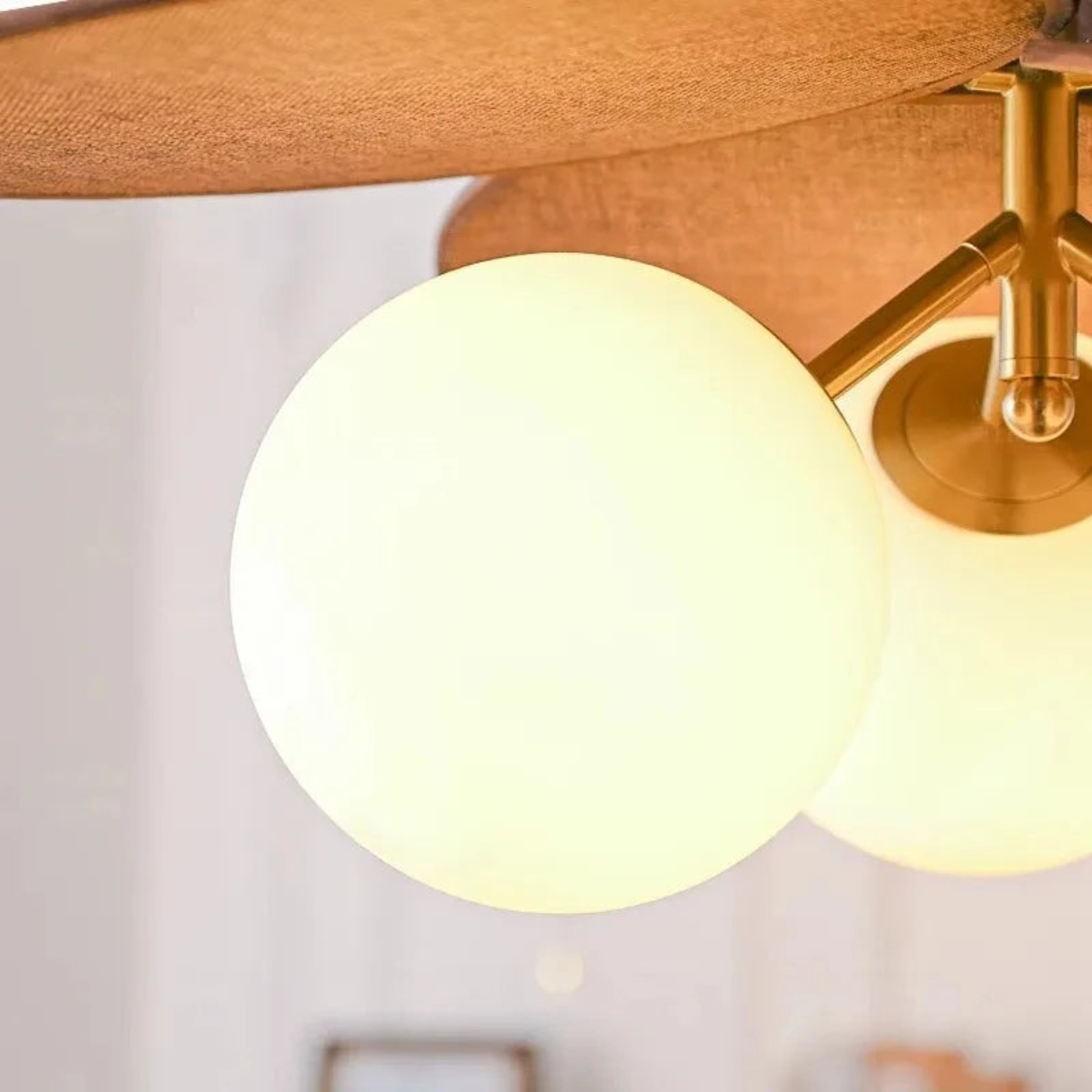 Close-up of a ceiling light fixture with a warm glow.