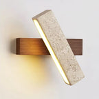 Modern wall light fixture with concrete and wood design on a white background