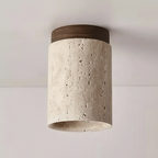 Ceiling light fixture with concrete-like finish and wooden top on a plain background