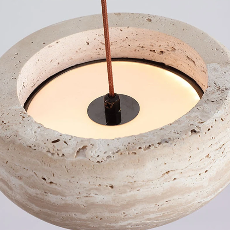 Close-up of a concrete pendant light with a neutral background