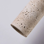 Textured ceramic pipe on a light gray background
