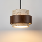 Pendant light with concrete-like finish and wooden accents on a neutral background