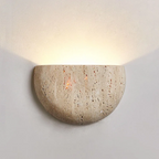 Round stone wall light fixture on a plain wall