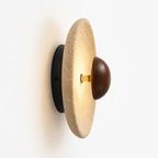 Wall-mounted light fixture with labeled components on a white background