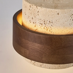 Close-up of a cylindrical concrete lamp with wooden band