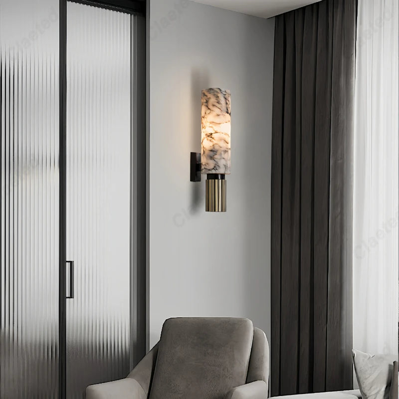 Modern wall sconce in a stylish interior setting with a chair and curtains.