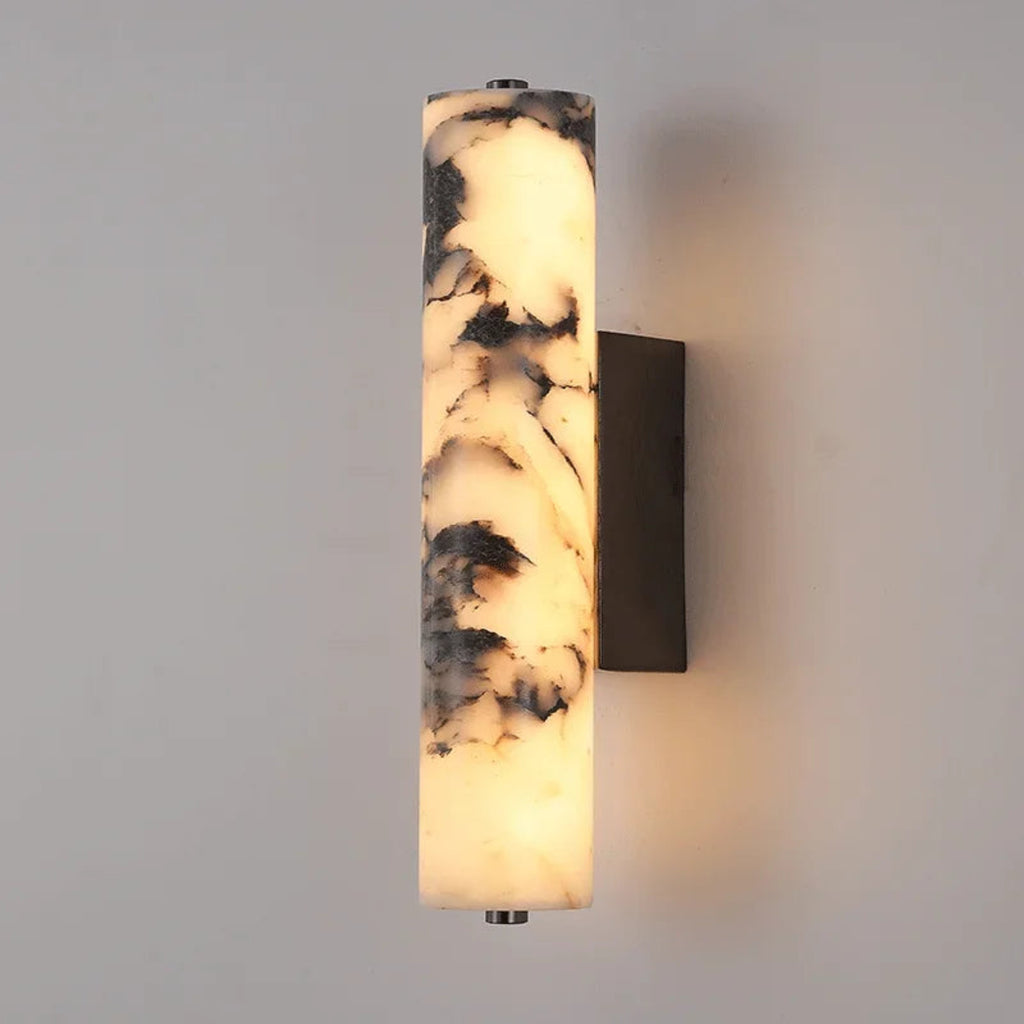 Wall-mounted light fixture with marble-like design on a gray wall