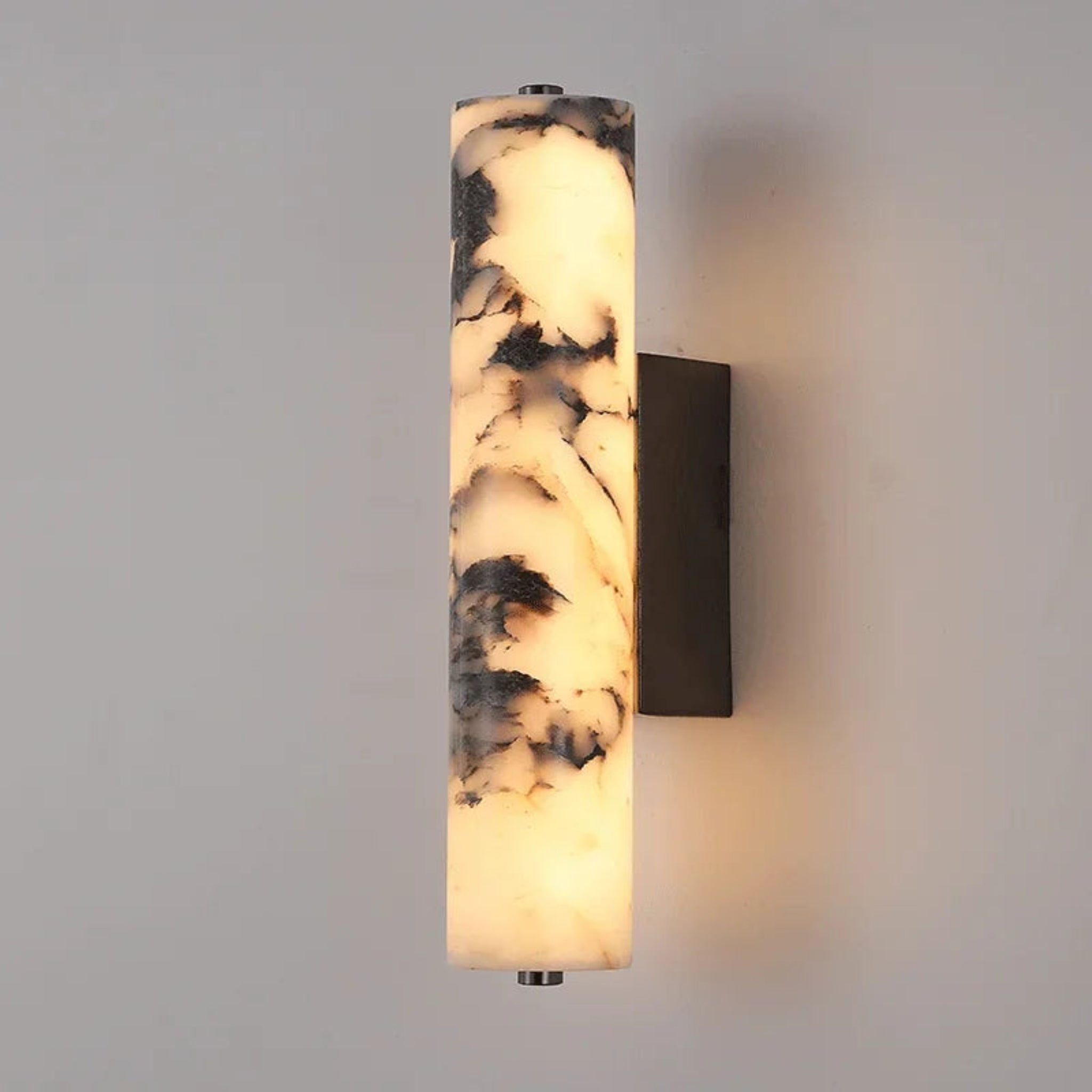Wall-mounted light fixture with marble-like design on a gray wall