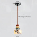 Pendant light with labeled parts on a gray background