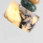 Marble-patterned ring on a light gray background