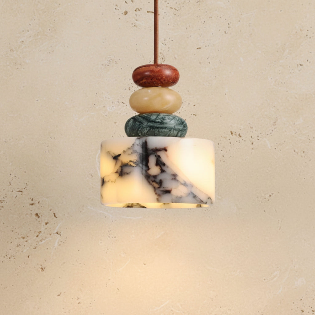 Marble-textured pendant light with wooden beads on a white background