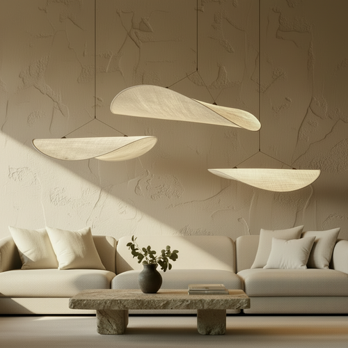 Modern living room with a gray sofa, coffee table, and pendant lights.