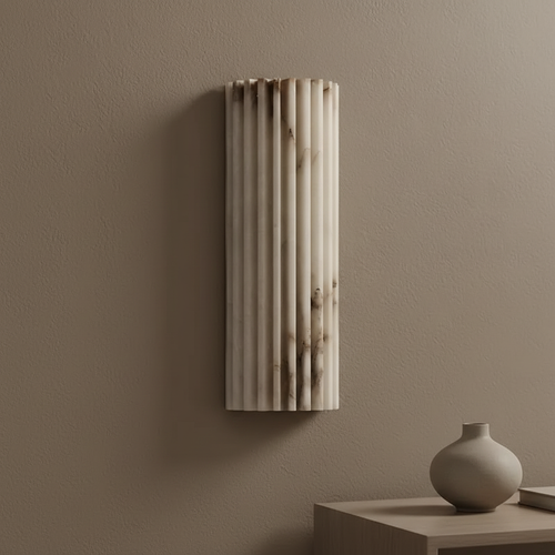 Decorative wall panel on a beige wall with a vase on a table below.