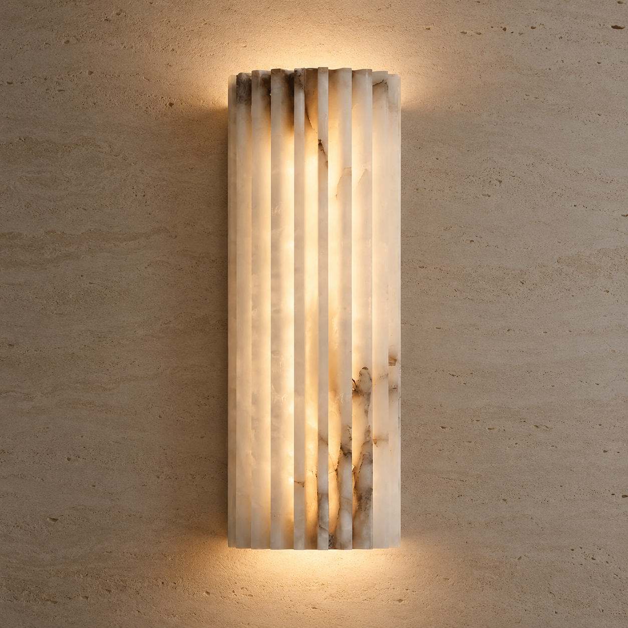 A modern vertical rectangular wall sconce made of fluted translucent stone, glowing with warm light against a textured beige plaster wall.