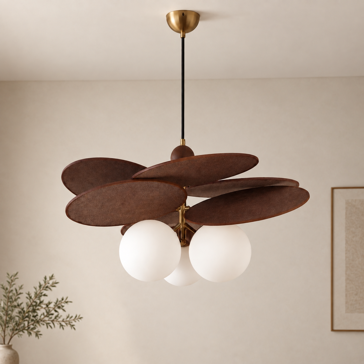A modern pendant light fixture with five overlapping dark brown wooden shades and three white frosted glass globes, hanging from a black cord with a brass ceiling canopy in a neutral room.
